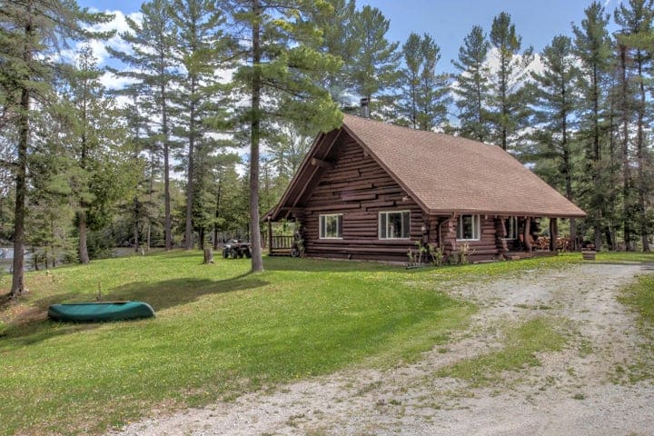 Log Home on Thunder Bay River W/ 22 Acres for Sale Hillman MI