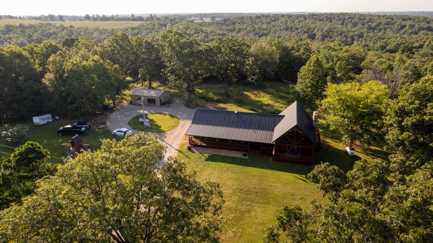 Custom Built Log Cabin and 57 Wooded Acres in Thayer MO