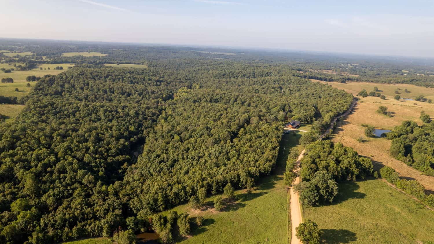 Custom Built Log Cabin and 57 Wooded Acres in Thayer MO