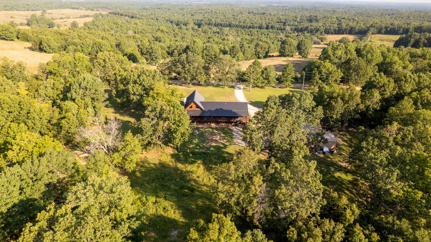 Custom Built Log Cabin and 57 Wooded Acres in Thayer MO