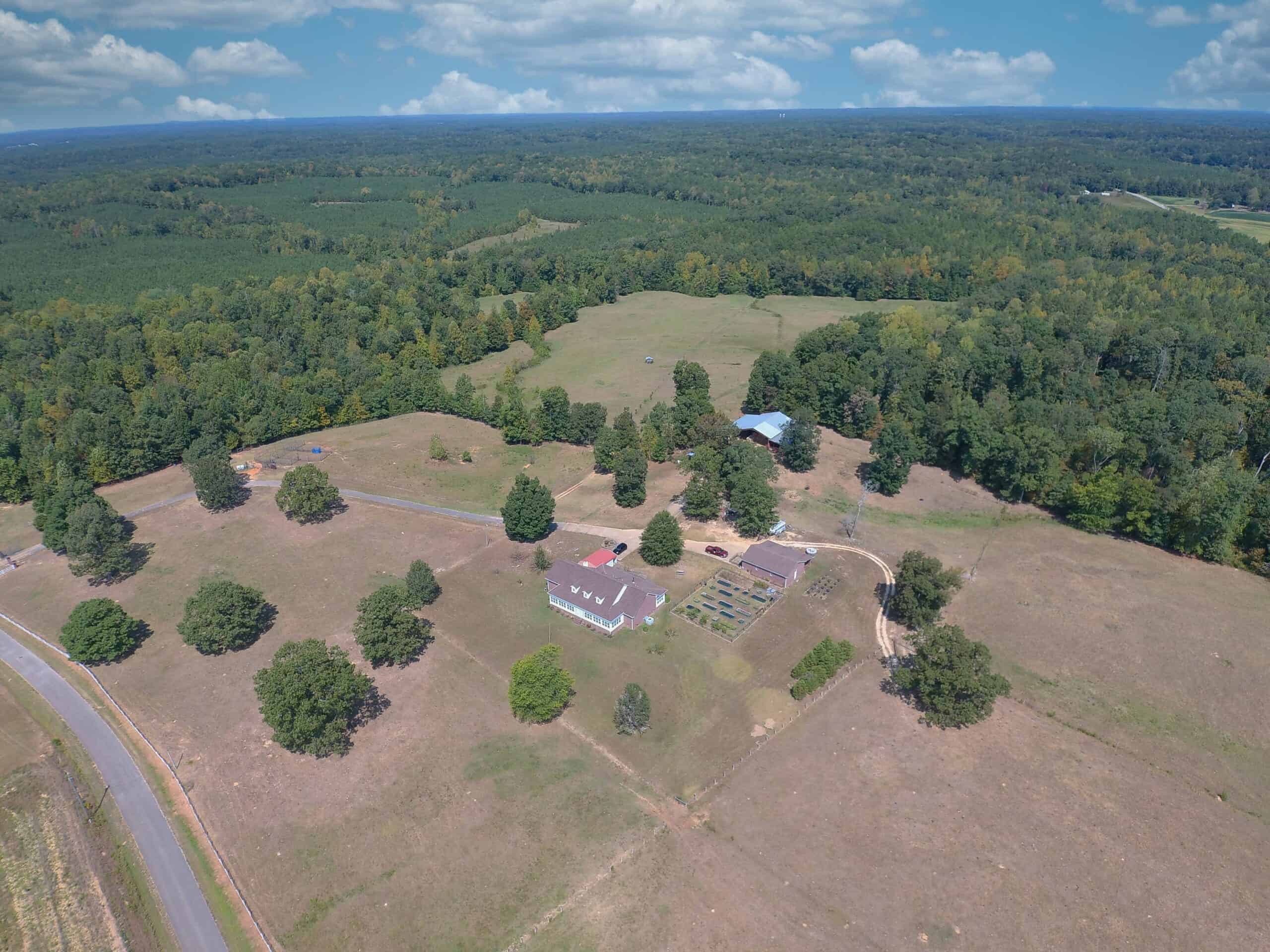 PRIVATE FARM FOR SALE IN TN NEAR TENNESSEE RIVER WITH POND, CREEK, FENCING, PASTURES, AND SHOP. GREAT DEER HUNTING.