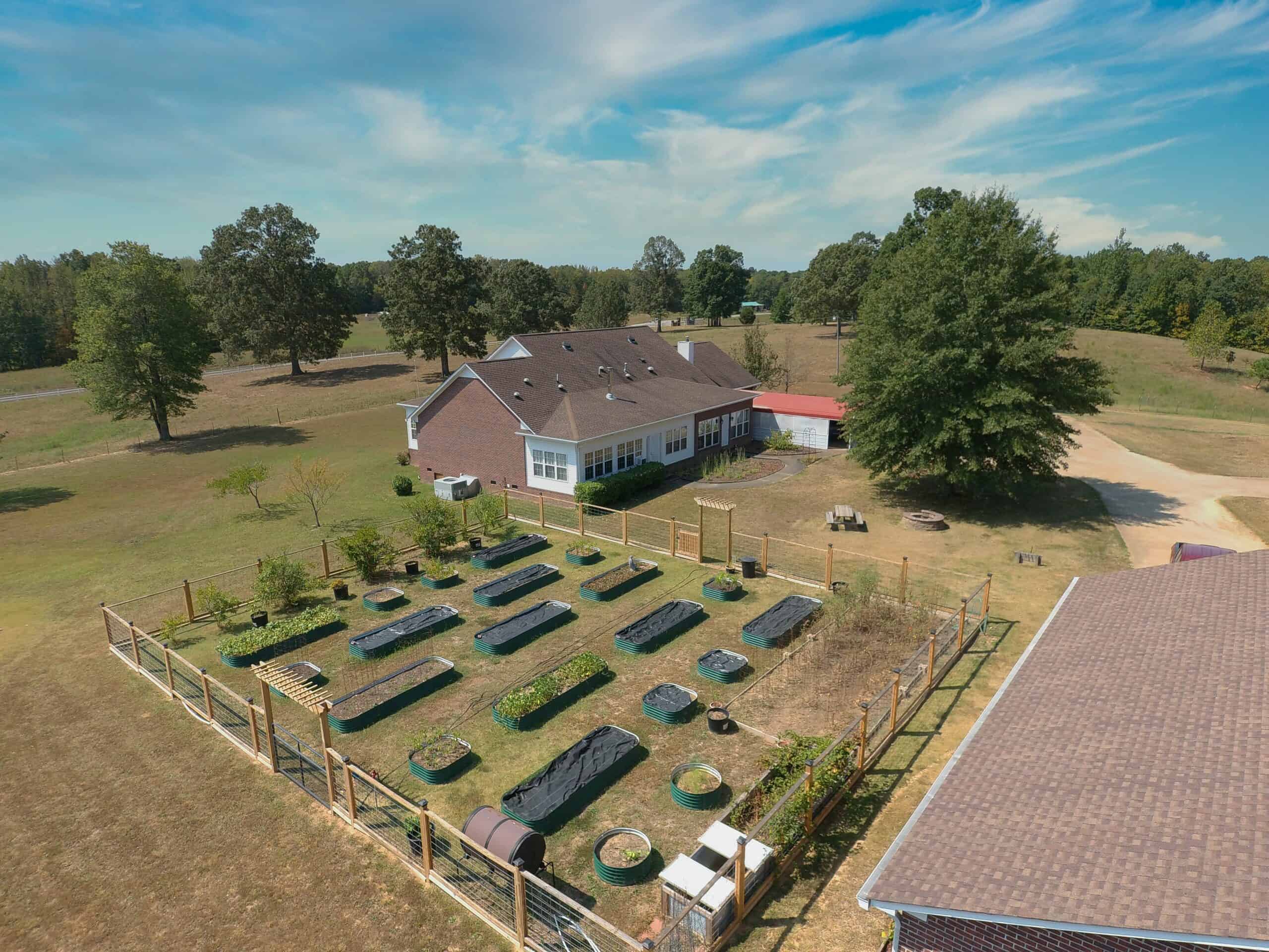PRIVATE FARM FOR SALE IN TN NEAR TENNESSEE RIVER WITH POND, CREEK, FENCING, PASTURES, AND SHOP. GREAT DEER HUNTING.