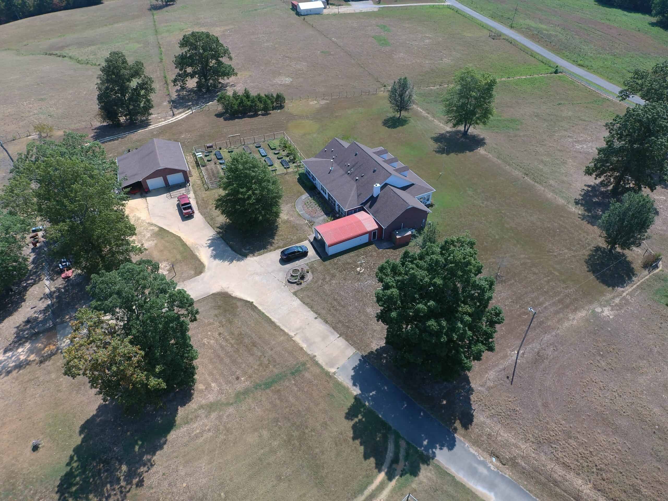 PRIVATE FARM FOR SALE IN TN NEAR TENNESSEE RIVER WITH POND, CREEK, FENCING, PASTURES, AND SHOP. GREAT DEER HUNTING.