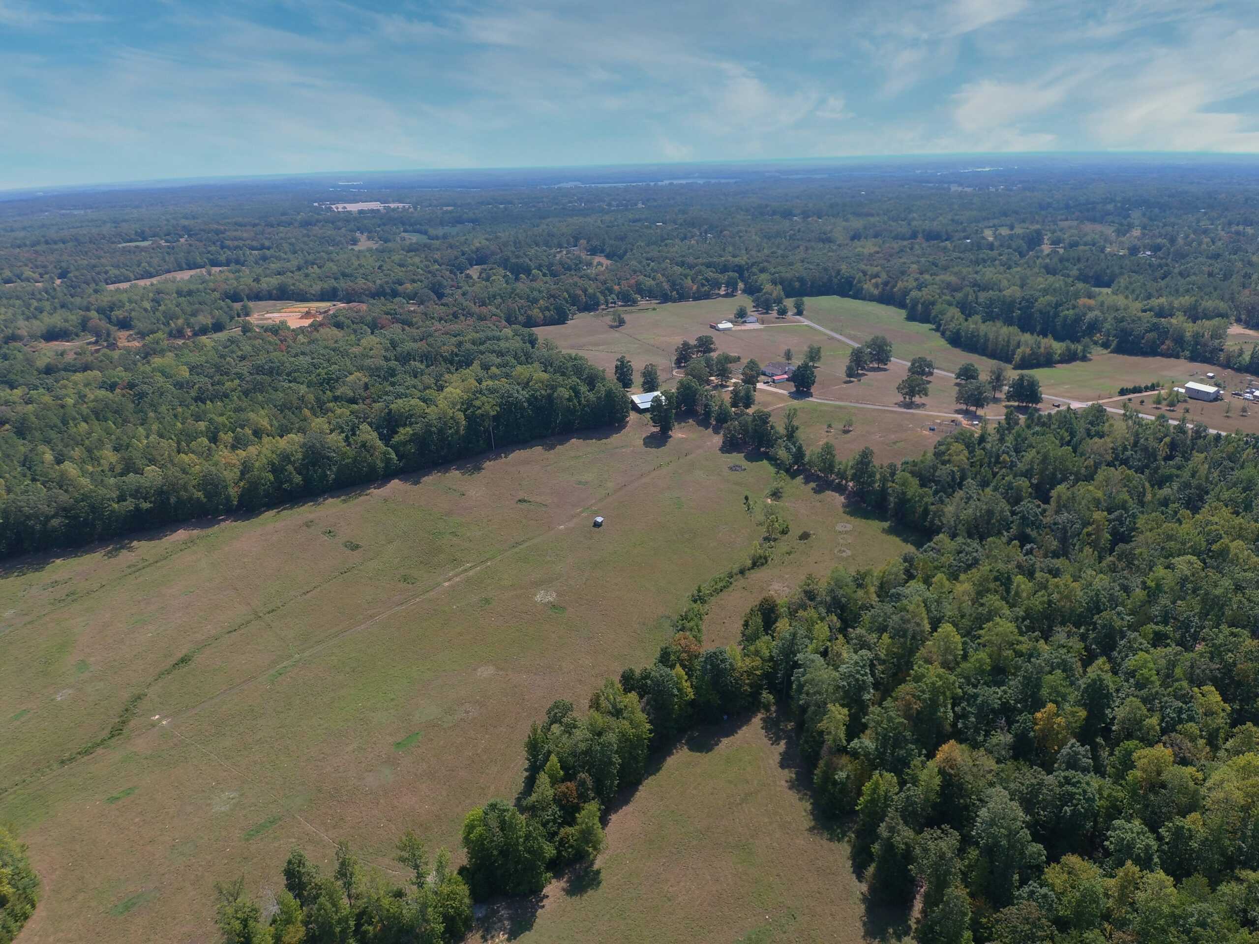 PRIVATE FARM FOR SALE IN TN NEAR TENNESSEE RIVER WITH POND, CREEK, FENCING, PASTURES, AND SHOP. GREAT DEER HUNTING.