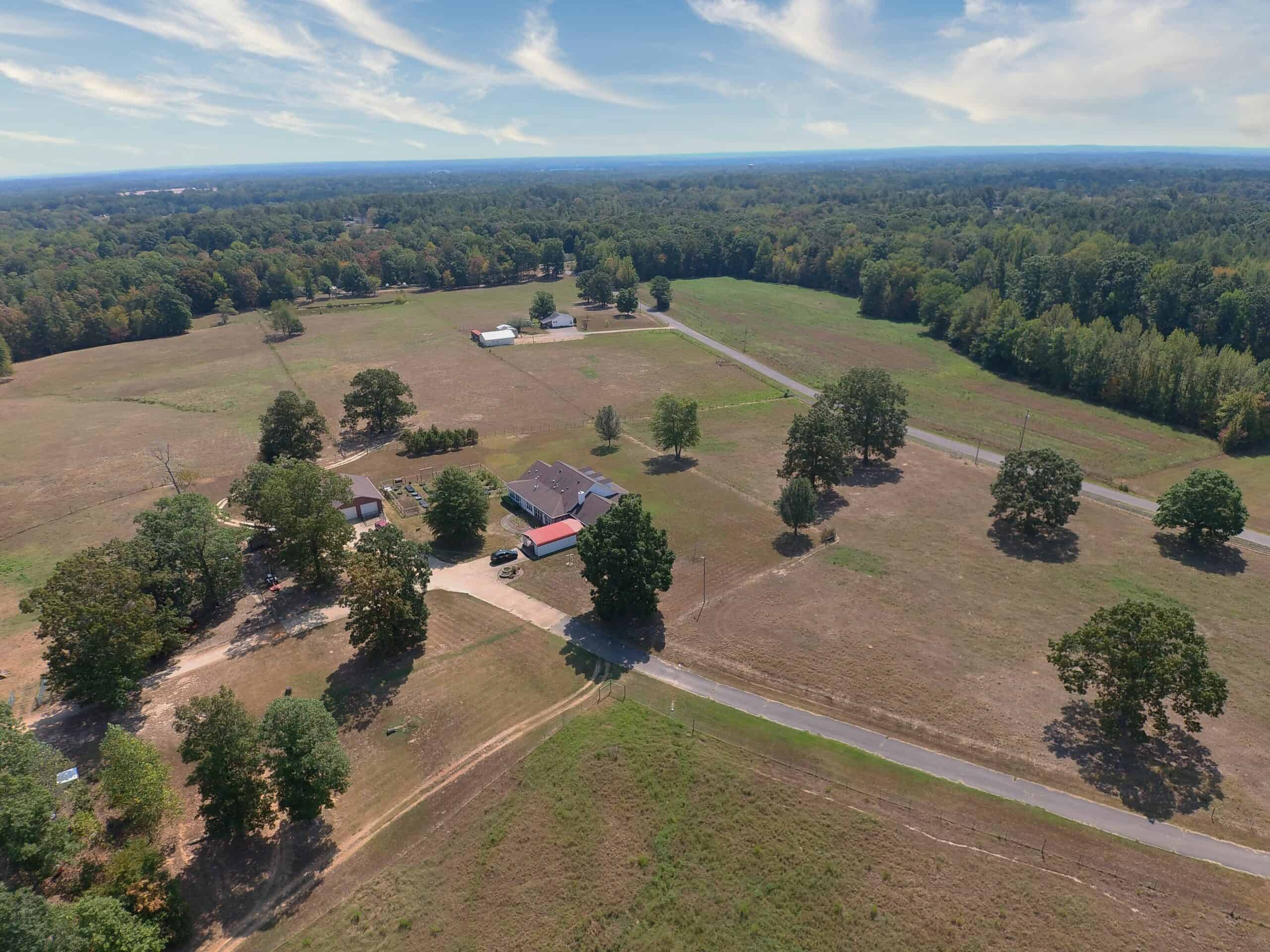 PRIVATE FARM FOR SALE IN TN NEAR TENNESSEE RIVER WITH POND, CREEK, FENCING, PASTURES, AND SHOP. GREAT DEER HUNTING.