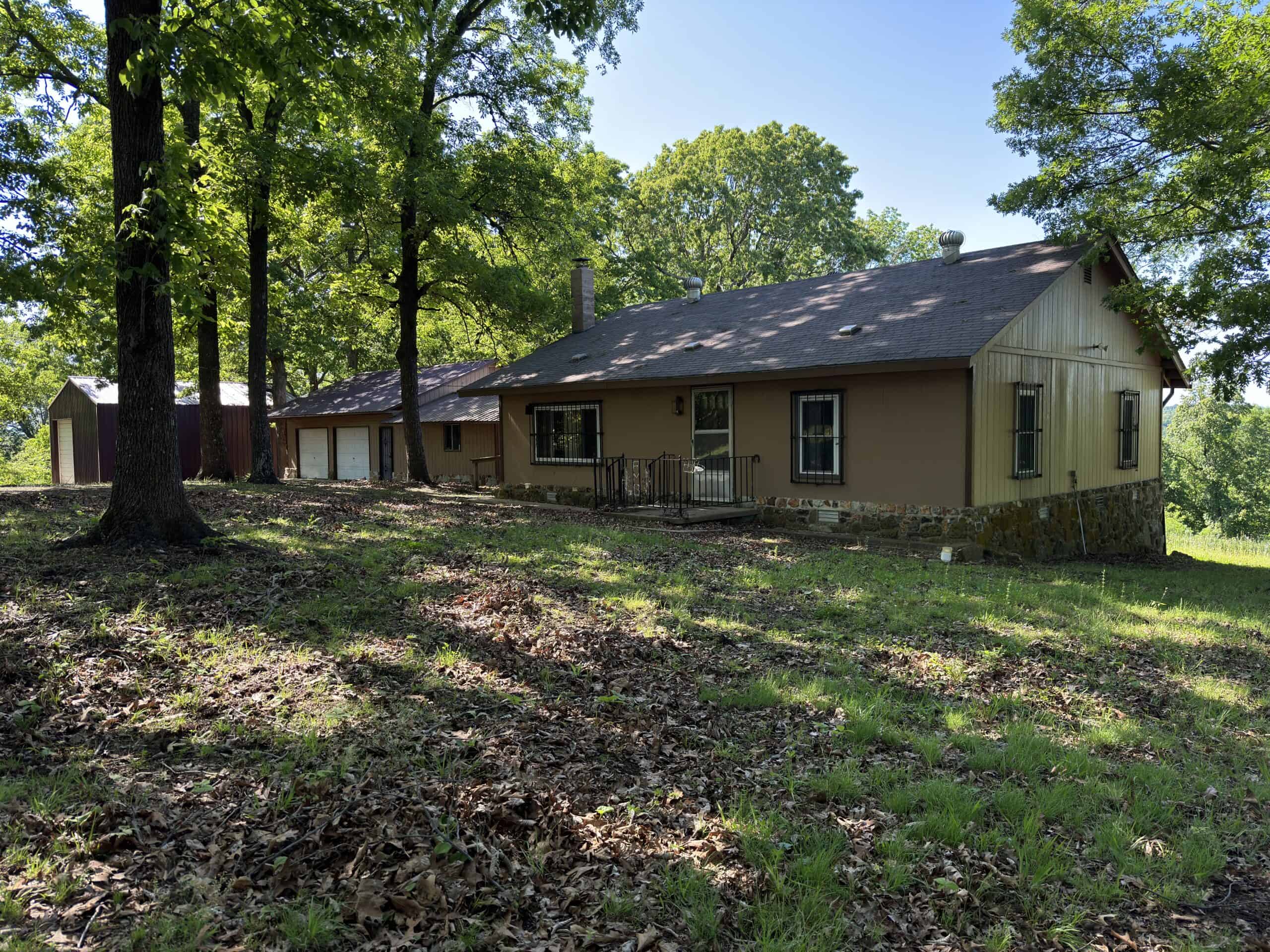 HOME WITH LARGE HUNTING ACREAGE AND FARMING LAND IN ARKANSAS
