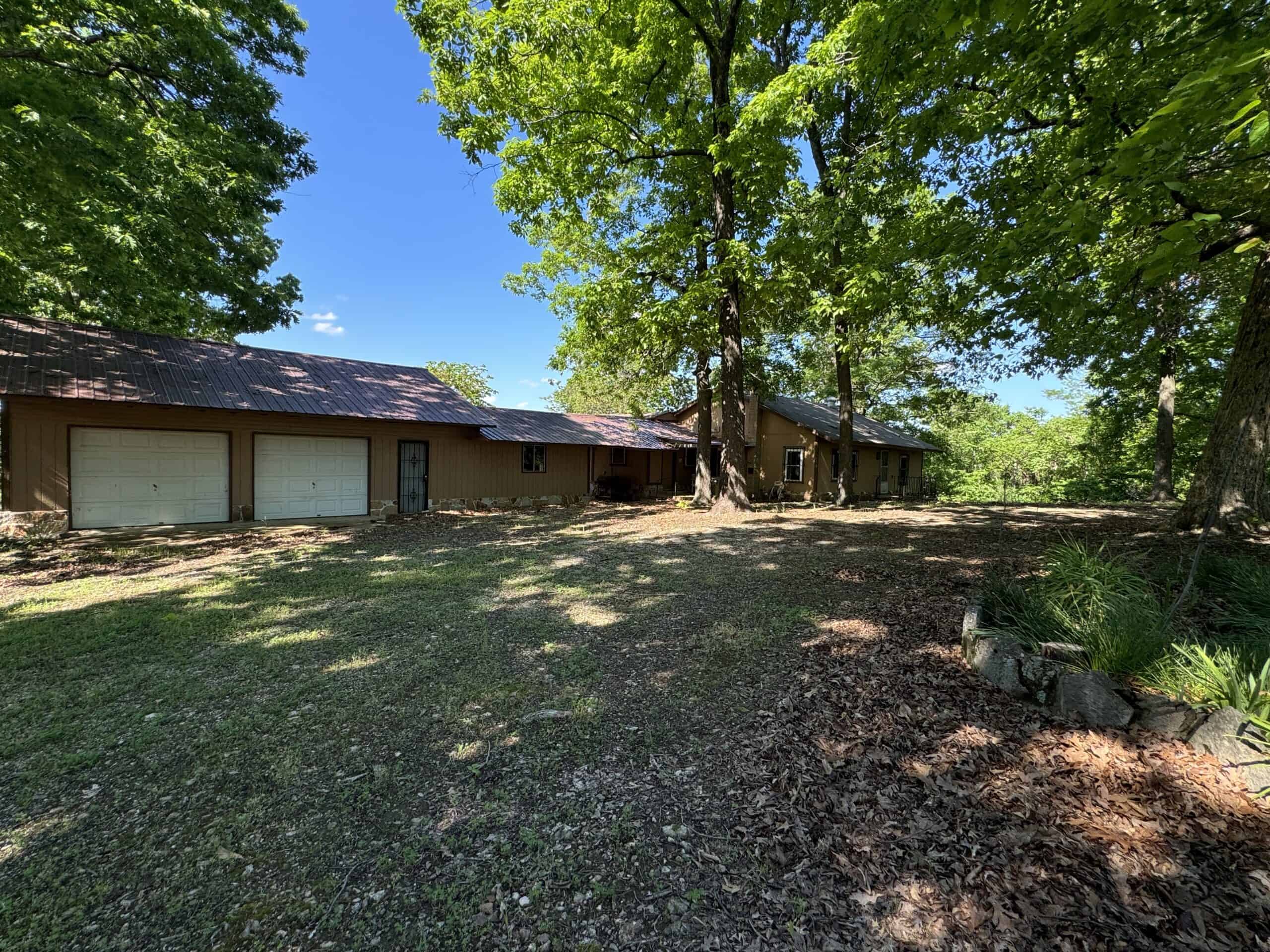 HOME WITH LARGE HUNTING ACREAGE AND FARMING LAND IN ARKANSAS