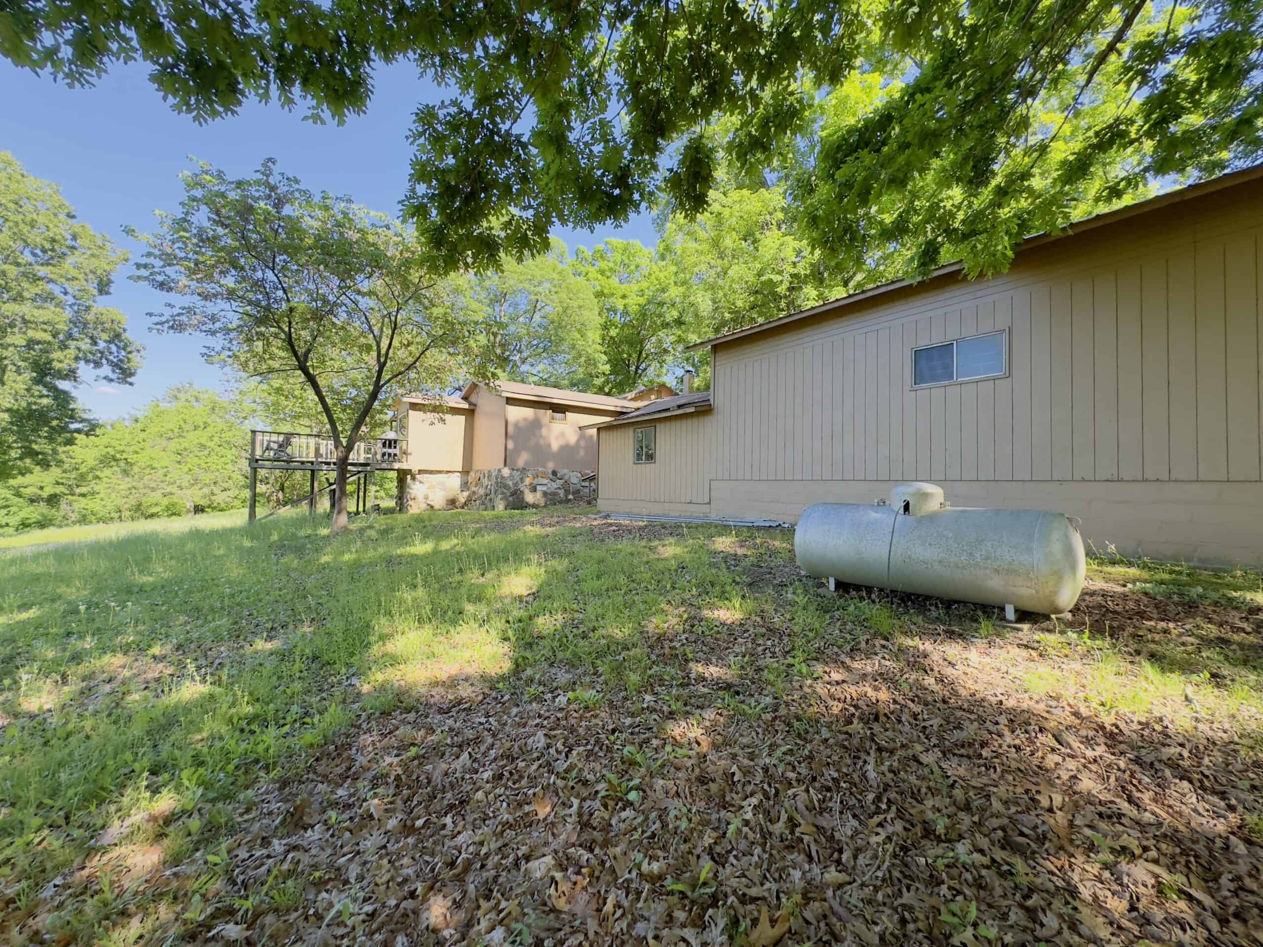 HOME WITH LARGE HUNTING ACREAGE AND FARMING LAND IN ARKANSAS
