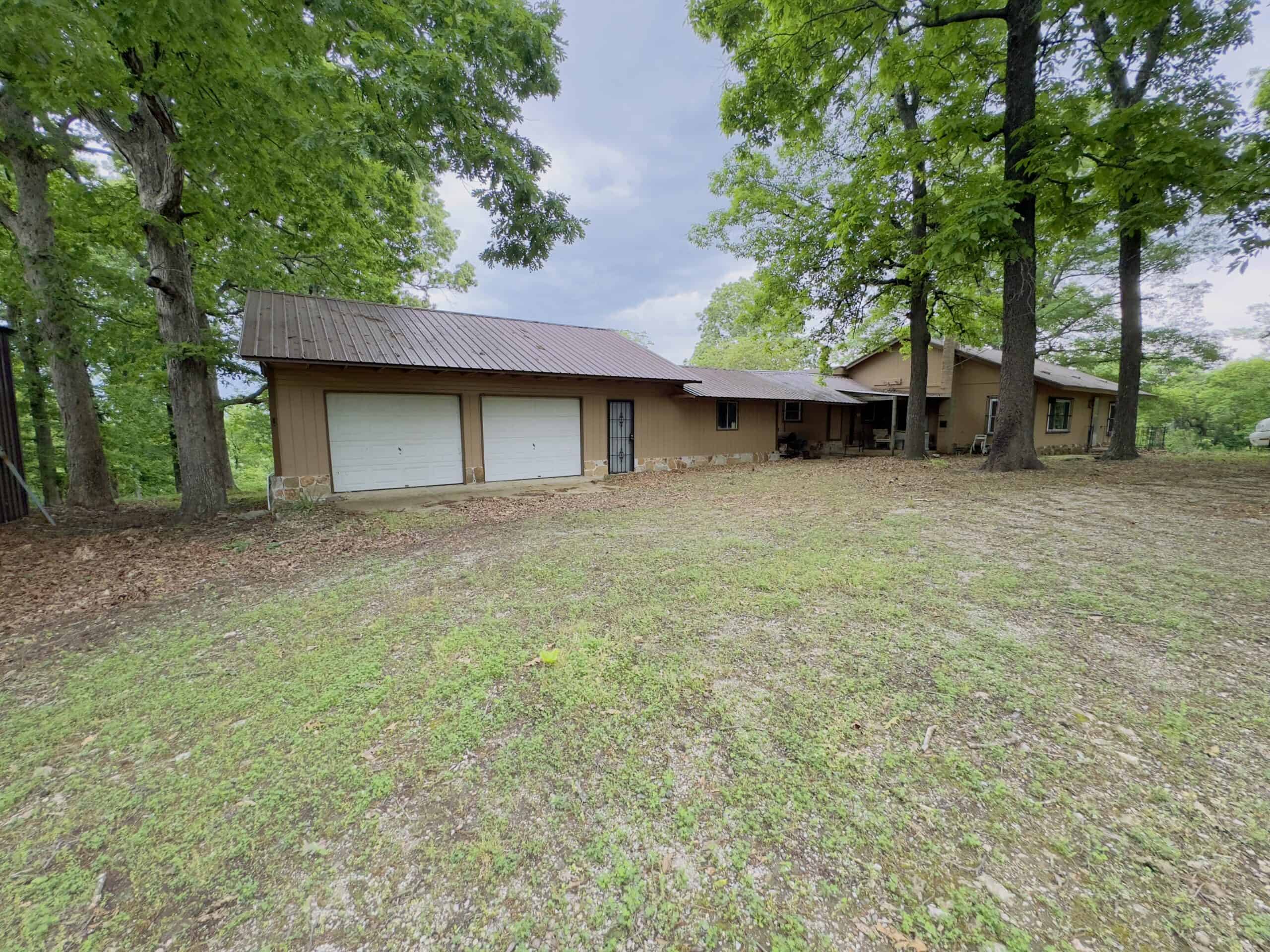 HOME WITH LARGE HUNTING ACREAGE AND FARMING LAND IN ARKANSAS
