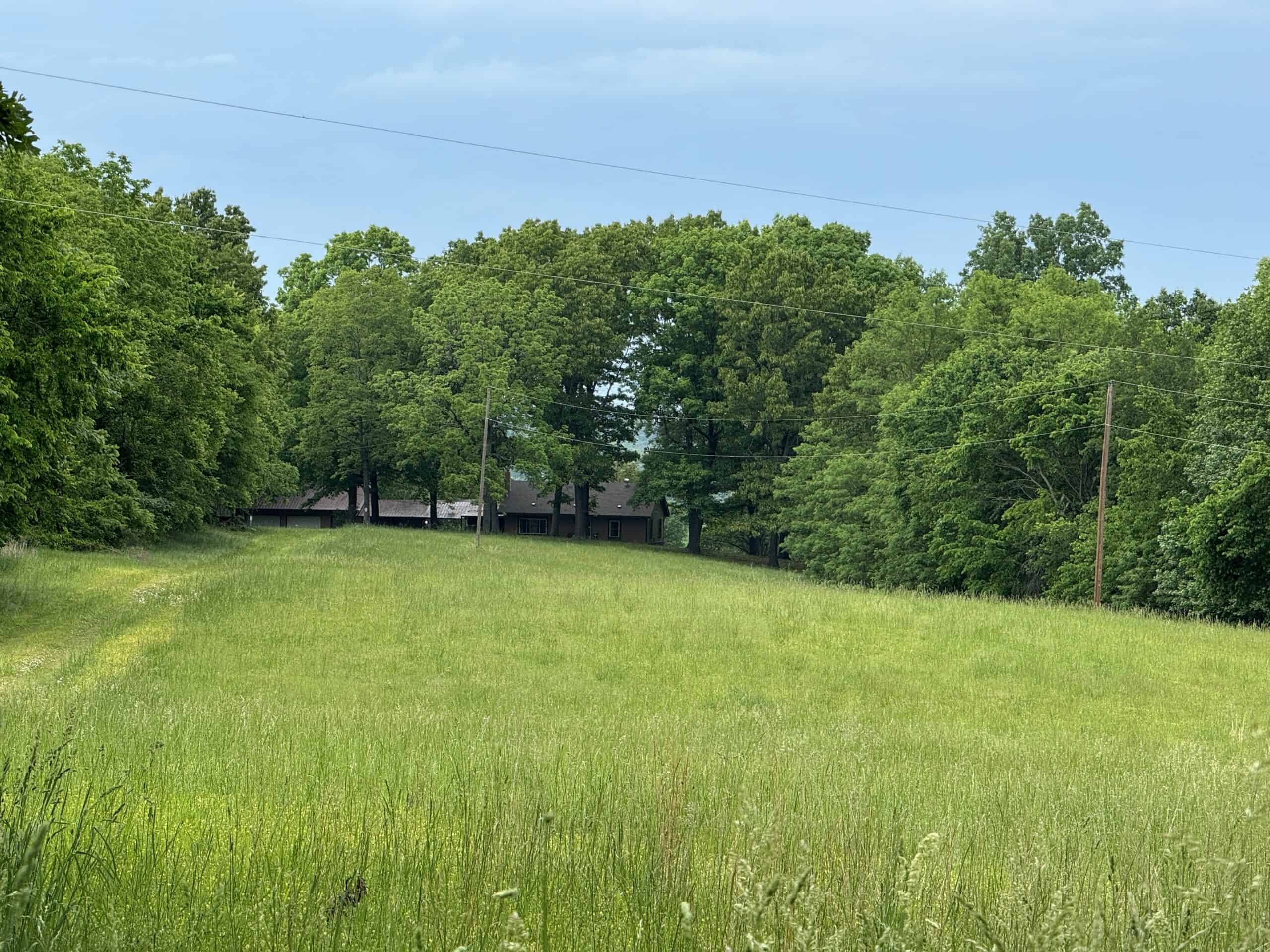 HOME WITH LARGE HUNTING ACREAGE AND FARMING LAND IN ARKANSAS