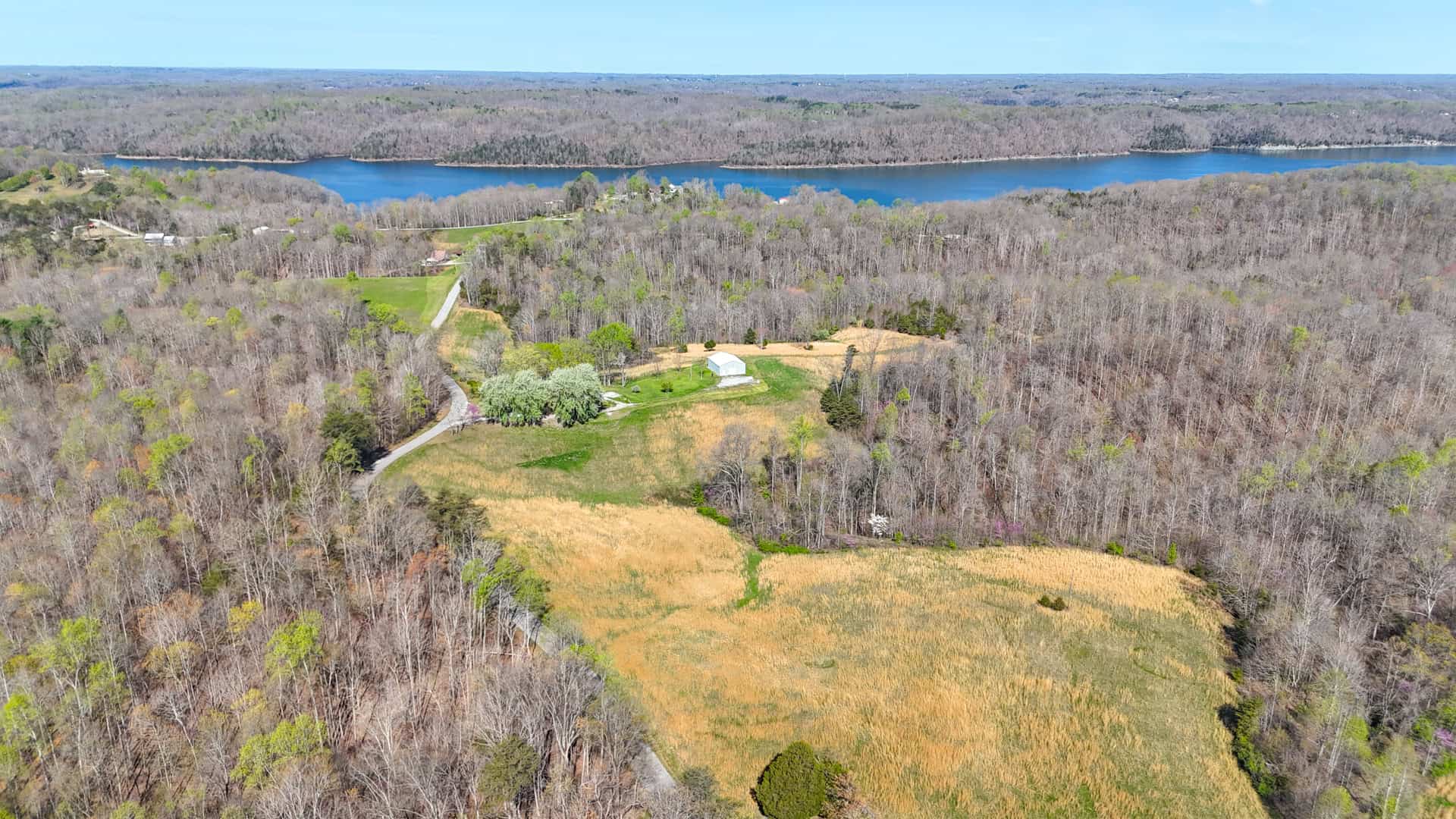 93 acre hunting property with home and large shop adjoining Lake Cumberland. Wayne County Kentucky. South Central Kentucky