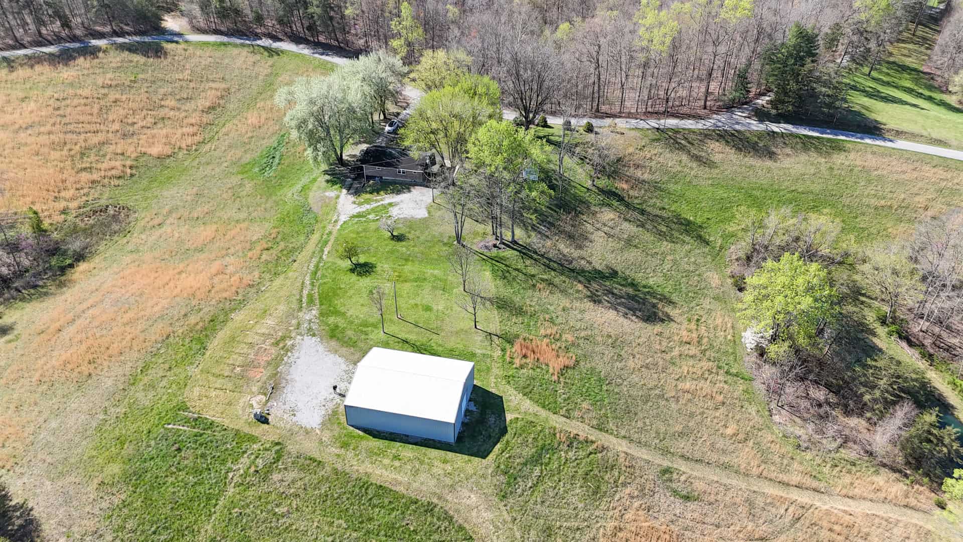 93 acre hunting property with home and large shop adjoining Lake Cumberland. Wayne County Kentucky. South Central Kentucky