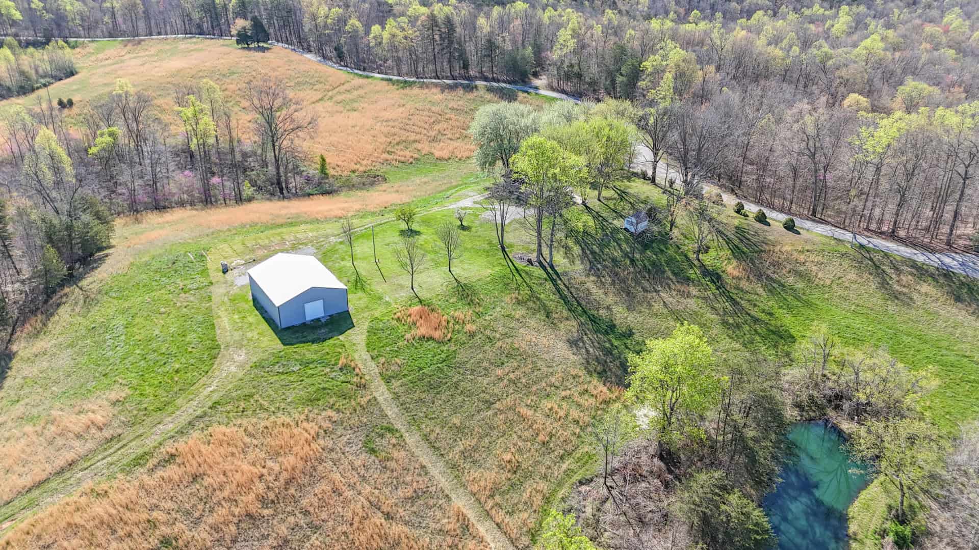 93 acre hunting property with home and large shop adjoining Lake Cumberland. Wayne County Kentucky. South Central Kentucky
