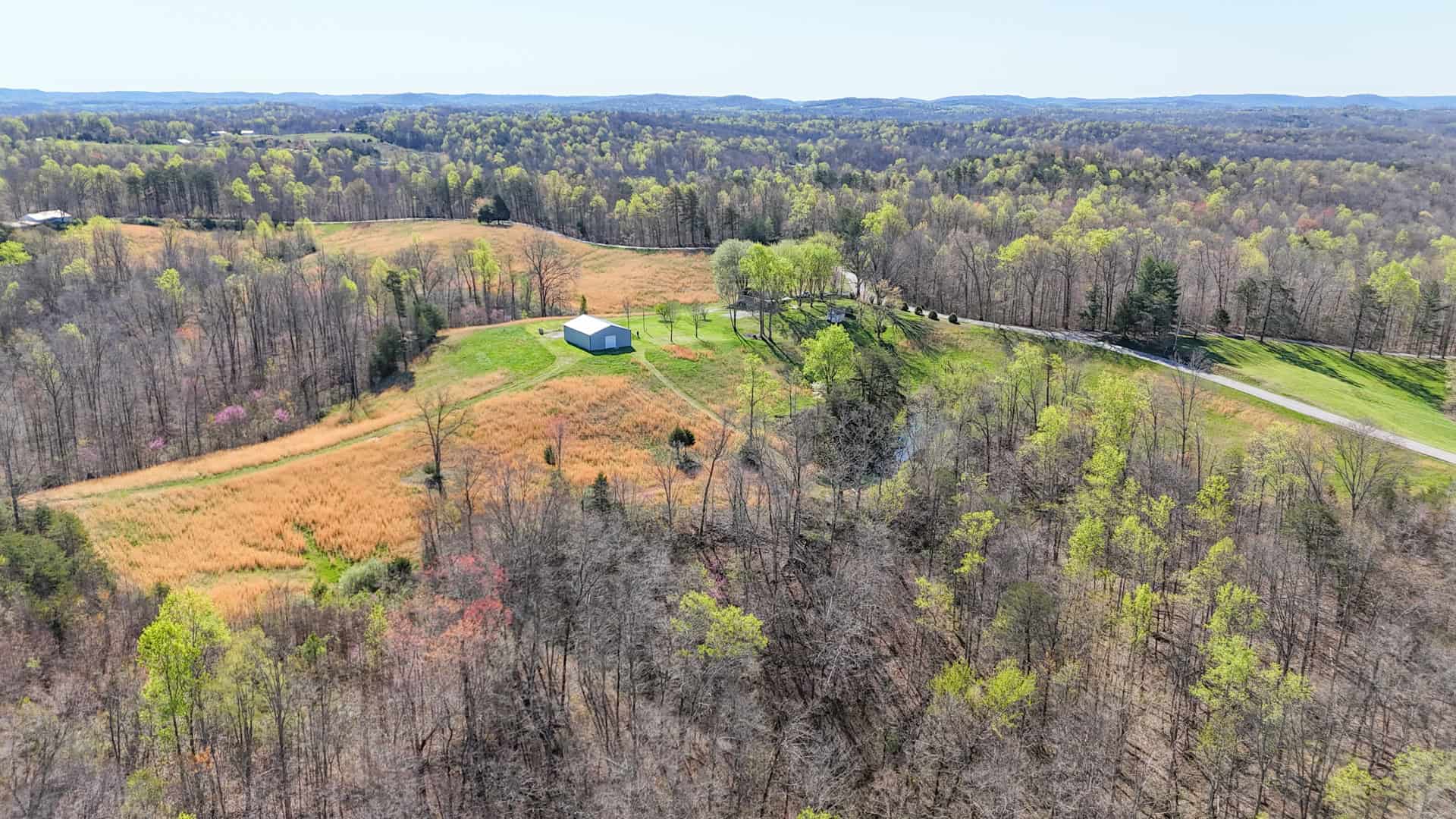 93 acre hunting property with home and large shop adjoining Lake Cumberland. Wayne County Kentucky. South Central Kentucky