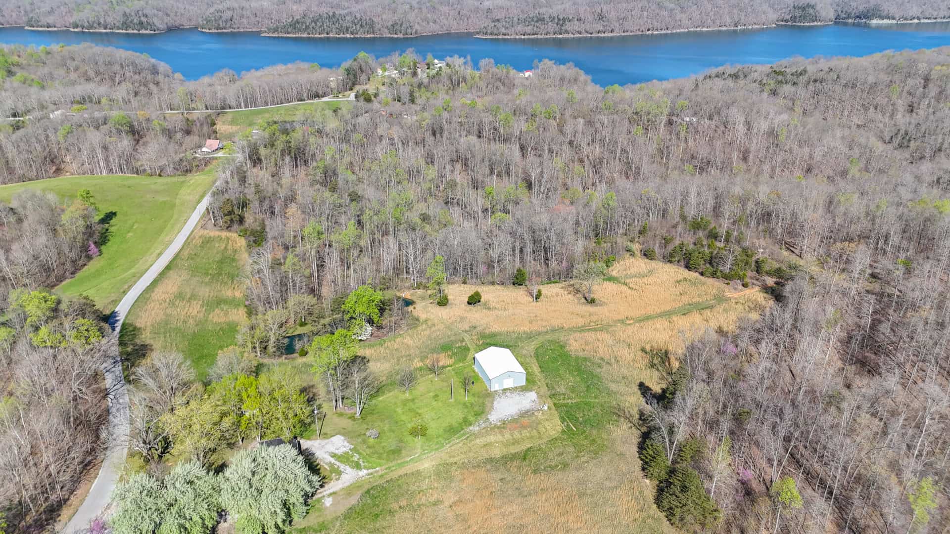 93 acre hunting property with home and large shop adjoining Lake Cumberland. Wayne County Kentucky. South Central Kentucky