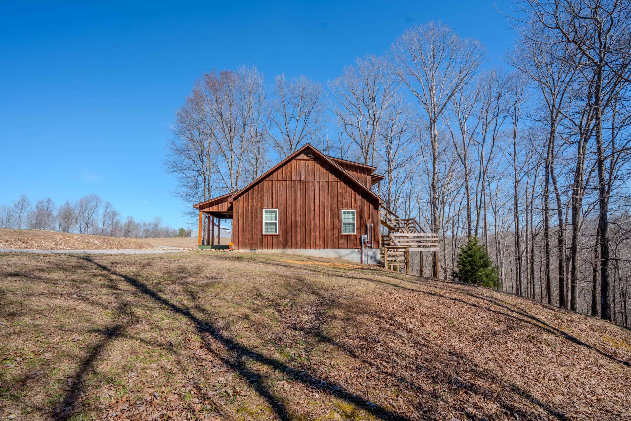 SECLUDED CABIN FOR SALE IN TENNESSEE WITH BARN & FENCING