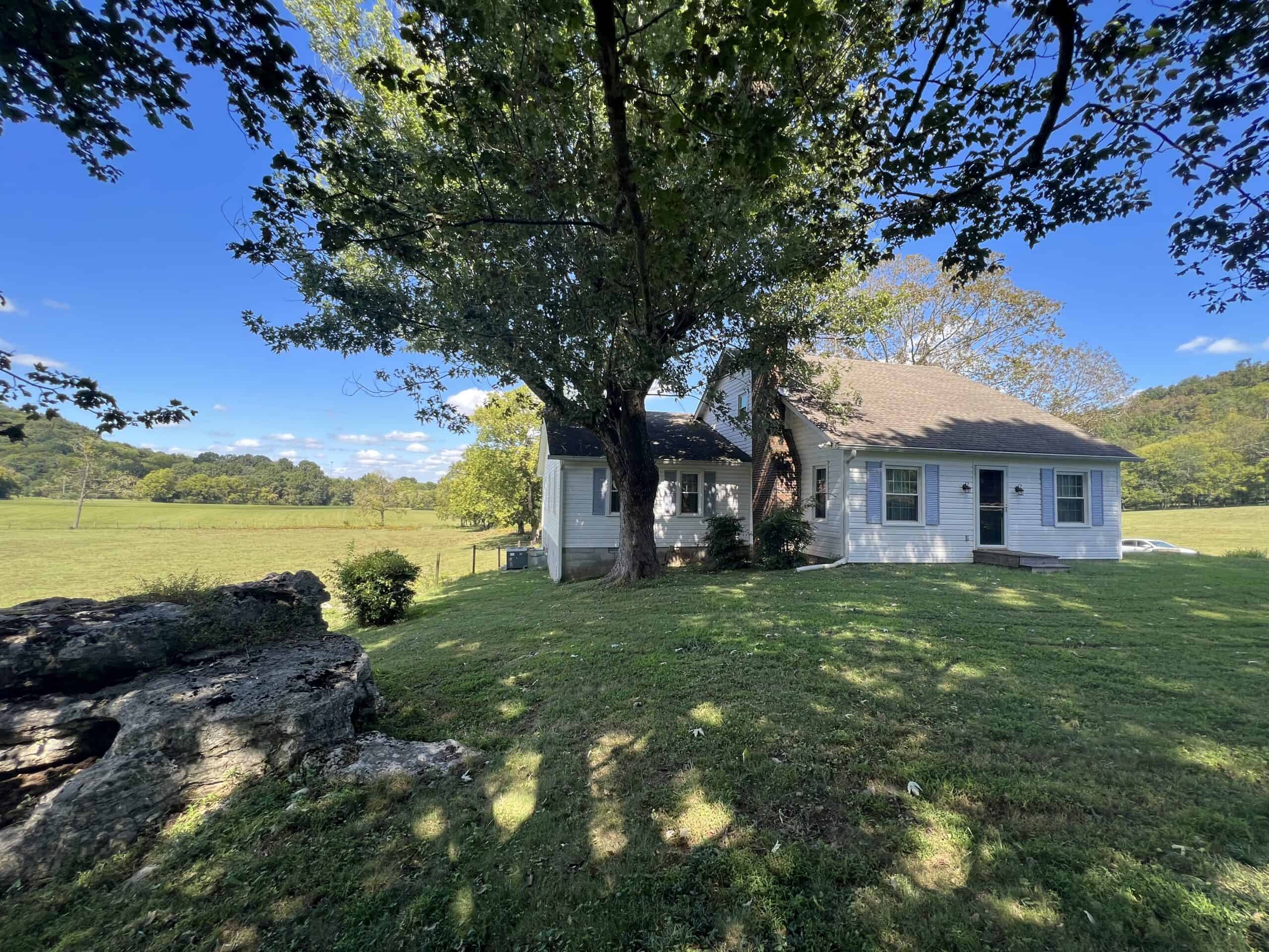 100 +/- ACRE FARM WITH HOUSE, CABIN, SHOP, BARN, POND