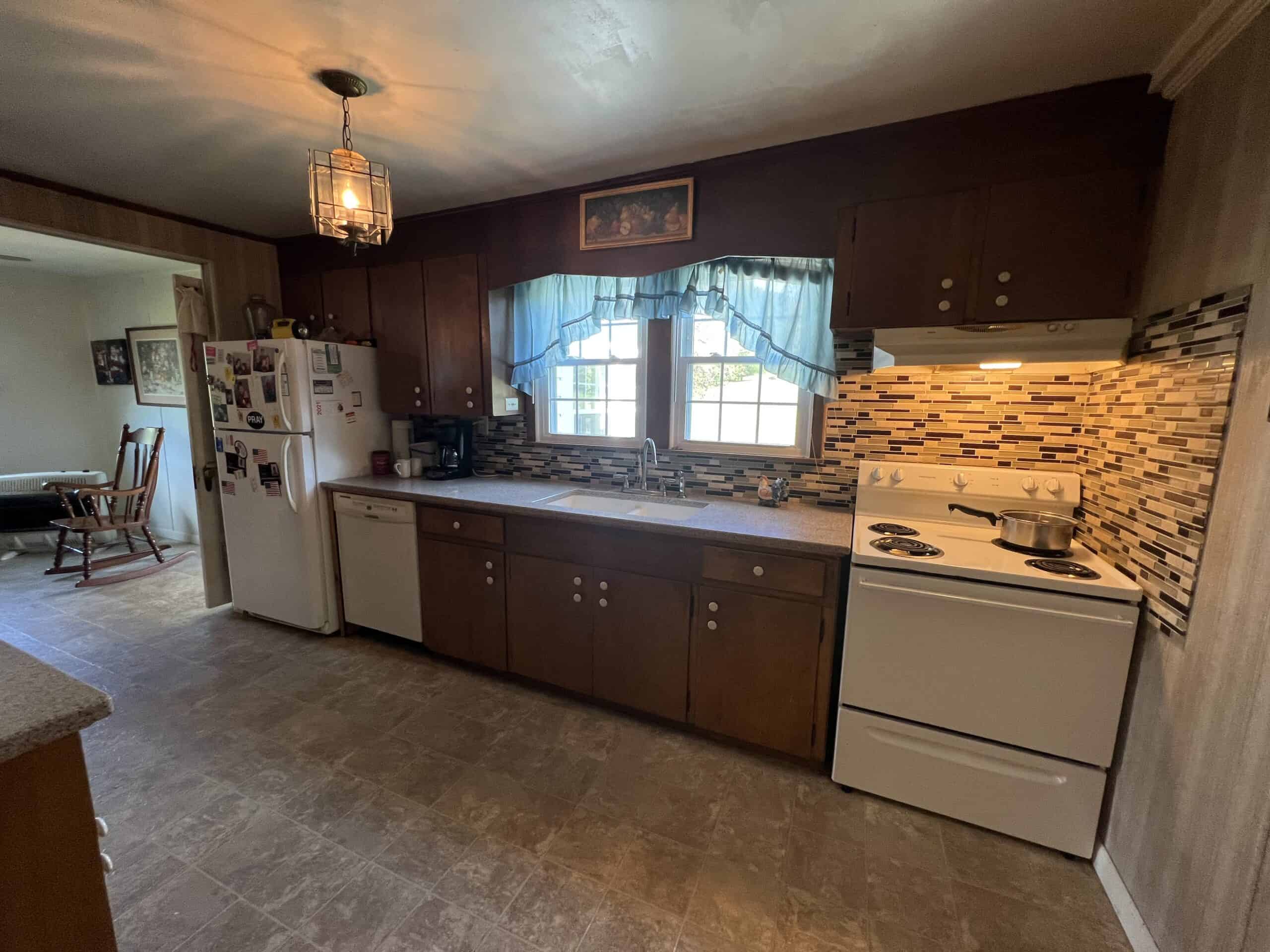 100 +/- ACRE FARM WITH HOUSE, CABIN, SHOP, BARN, POND