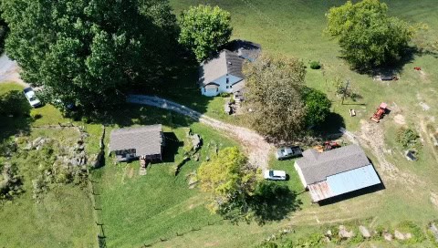 100 +/- ACRE FARM WITH HOUSE, CABIN, SHOP, BARN, POND