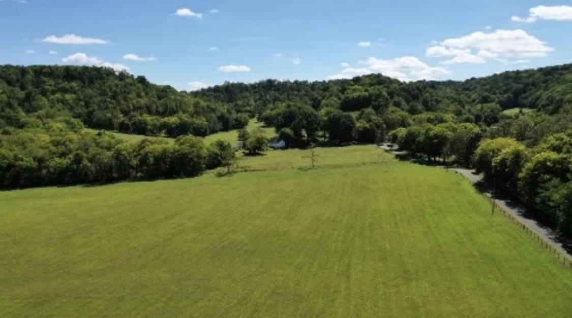 100 +/- ACRE FARM WITH HOUSE, CABIN, SHOP, BARN, POND