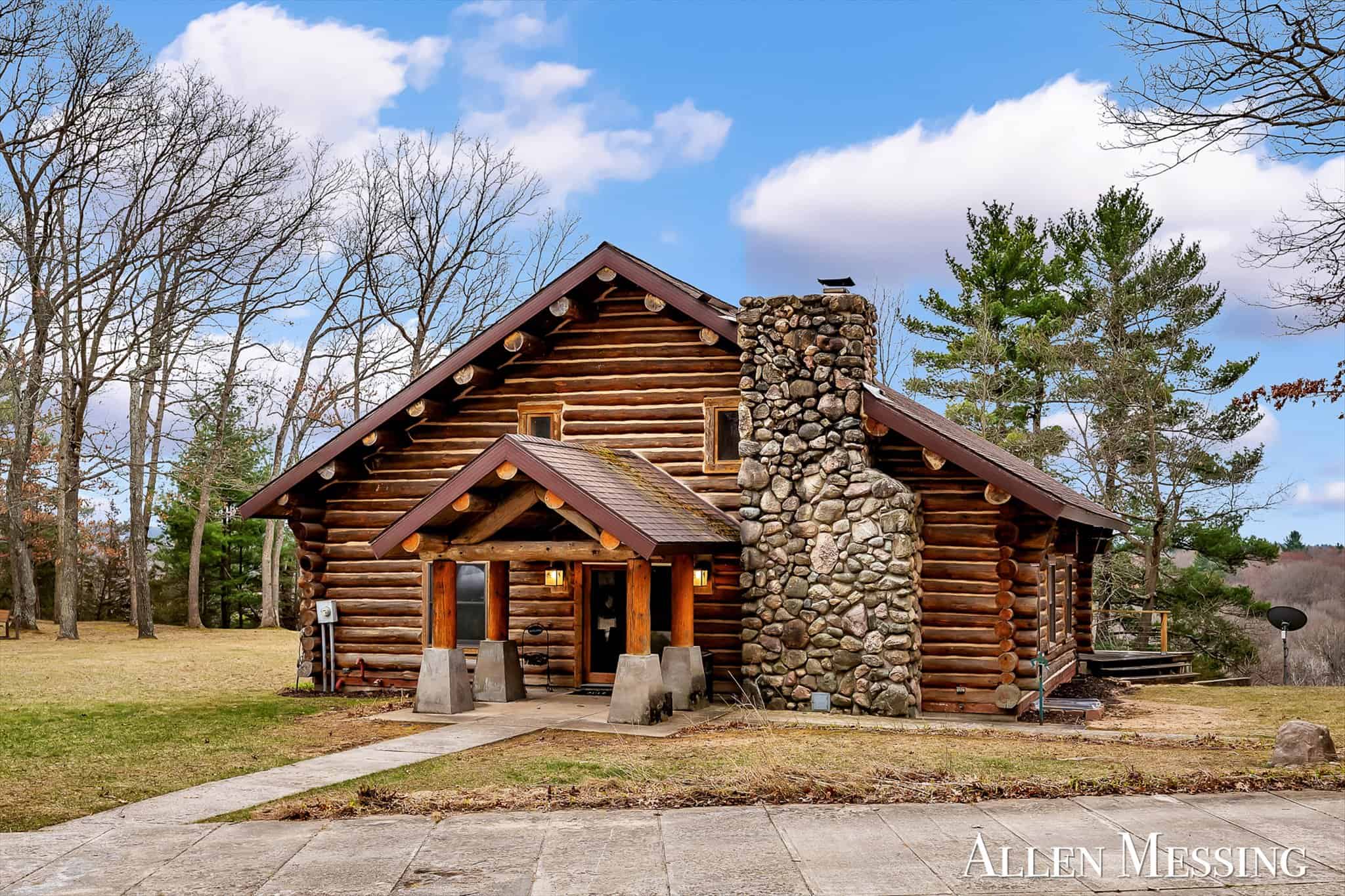 Custom Log Home on 10+ Acres with private Muskegon river frontage