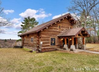 Custom Log Home on 10+ Acres with private Muskegon river frontage