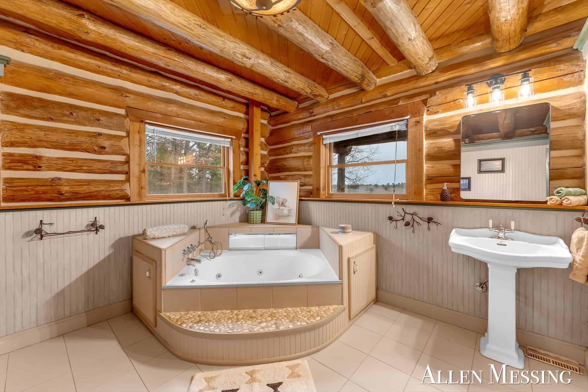 Custom Log Home on 10+ Acres with private Muskegon river frontage
