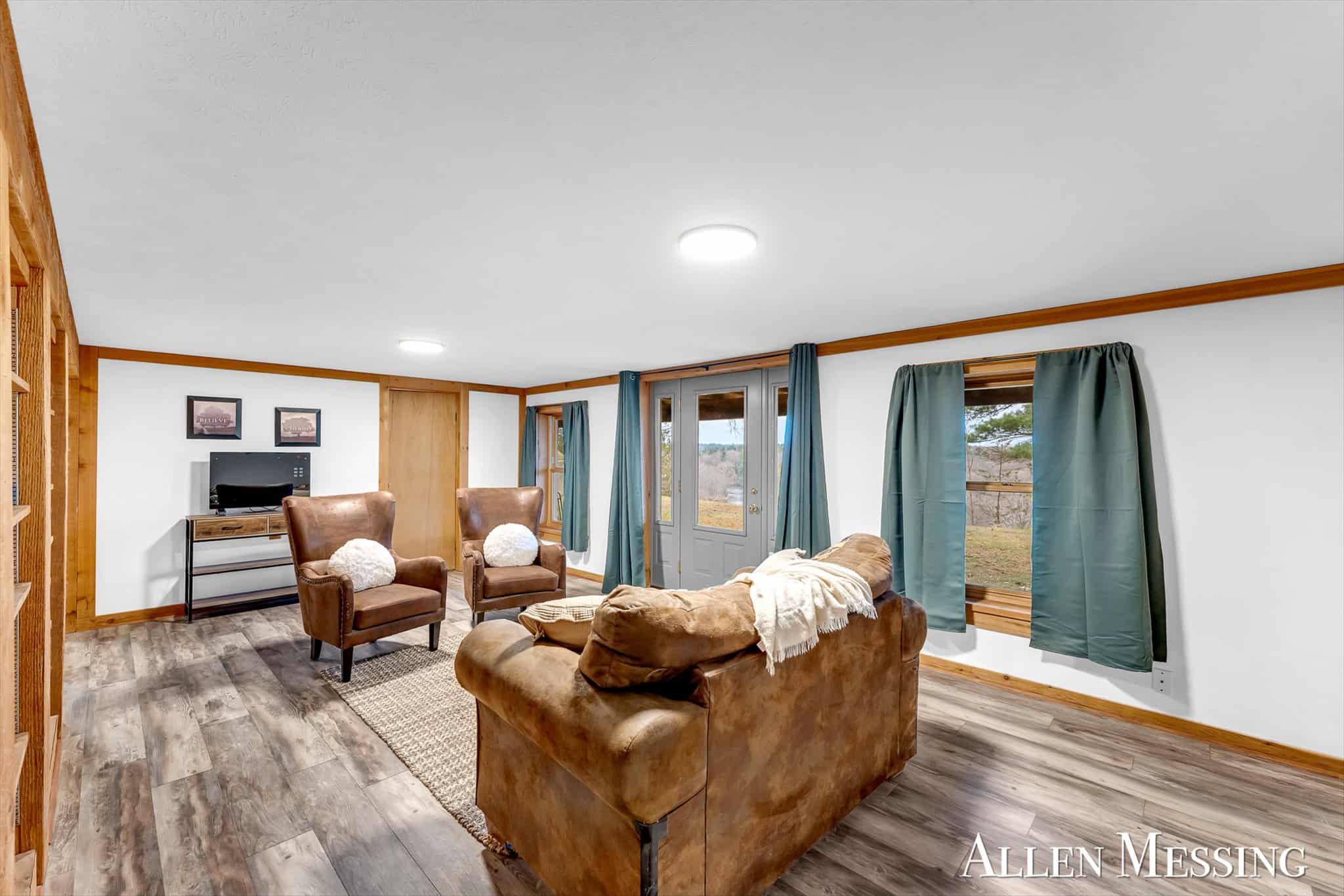 Custom Log Home on 10+ Acres with private Muskegon river frontage