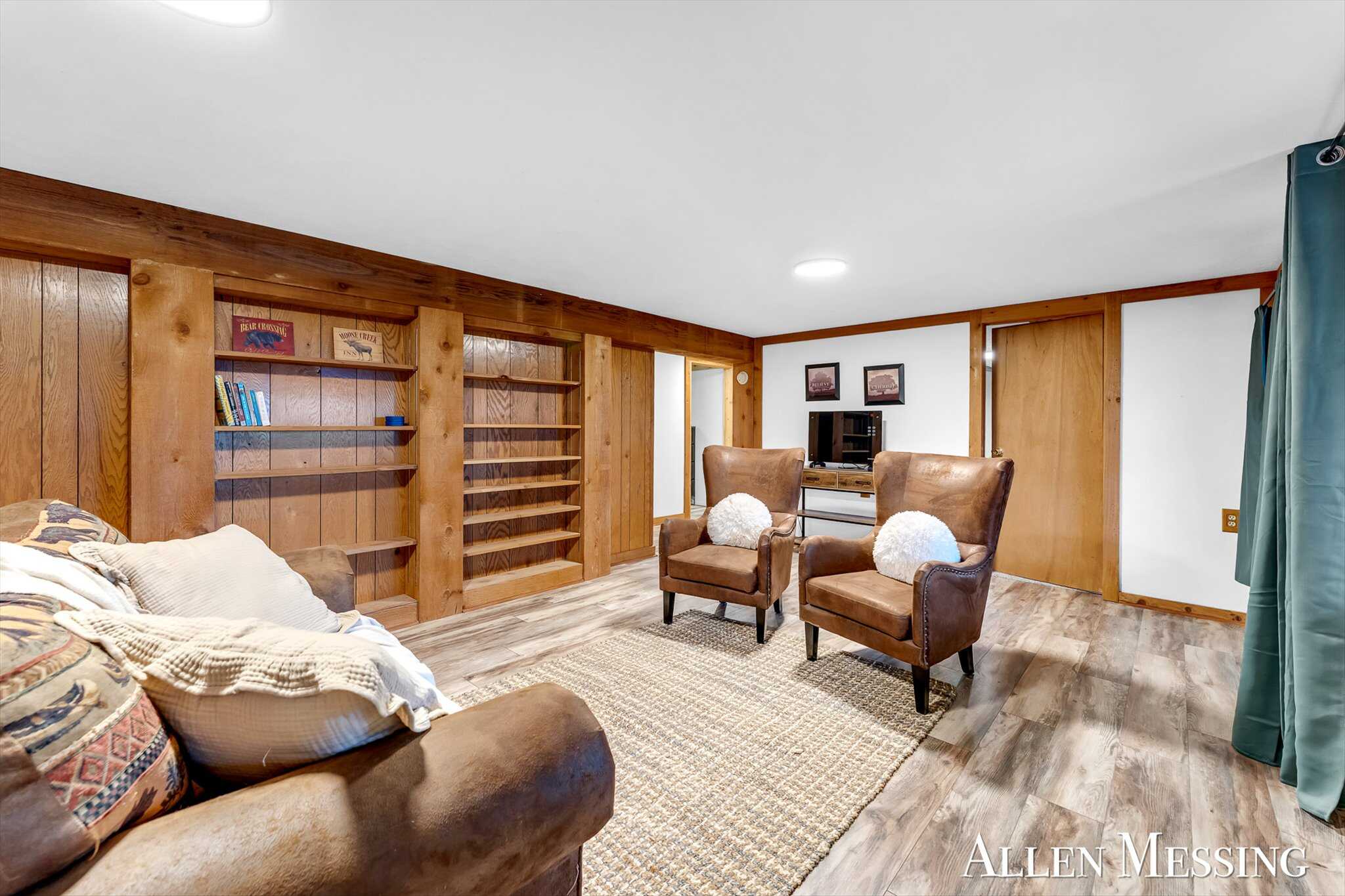Custom Log Home on 10+ Acres with private Muskegon river frontage