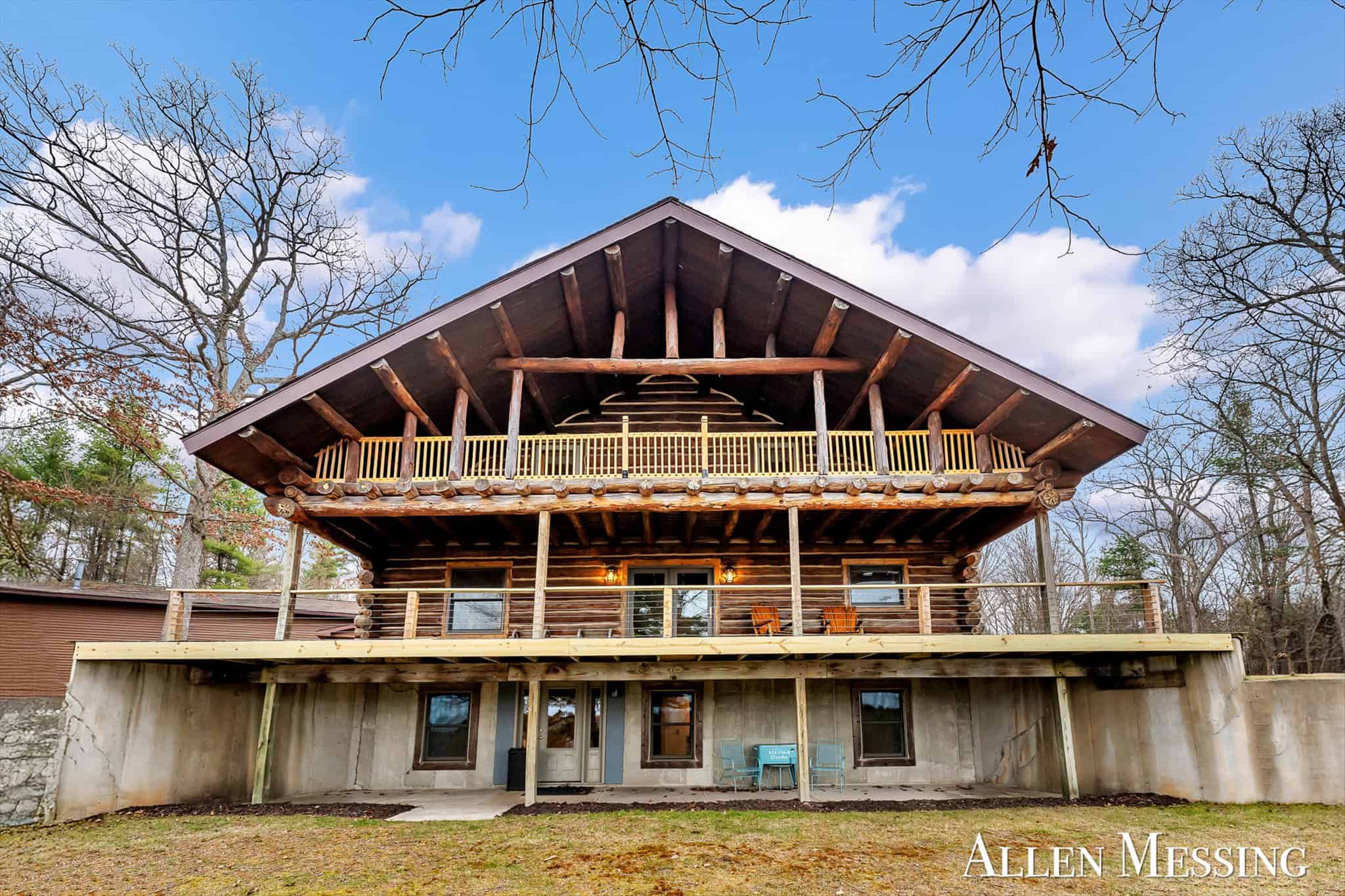 Custom Log Home on 10+ Acres with private Muskegon river frontage