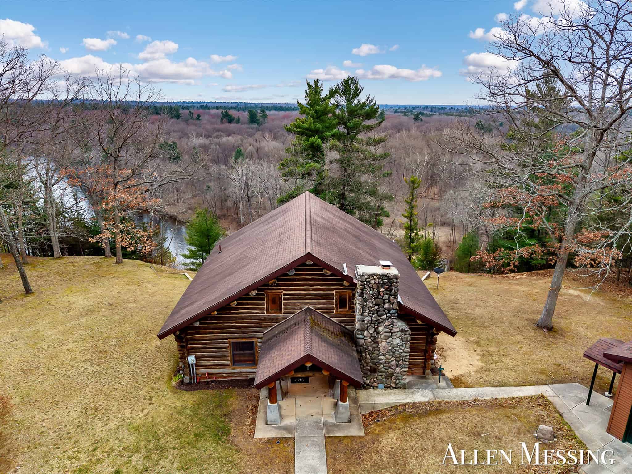 Custom Log Home on 10+ Acres with private Muskegon river frontage