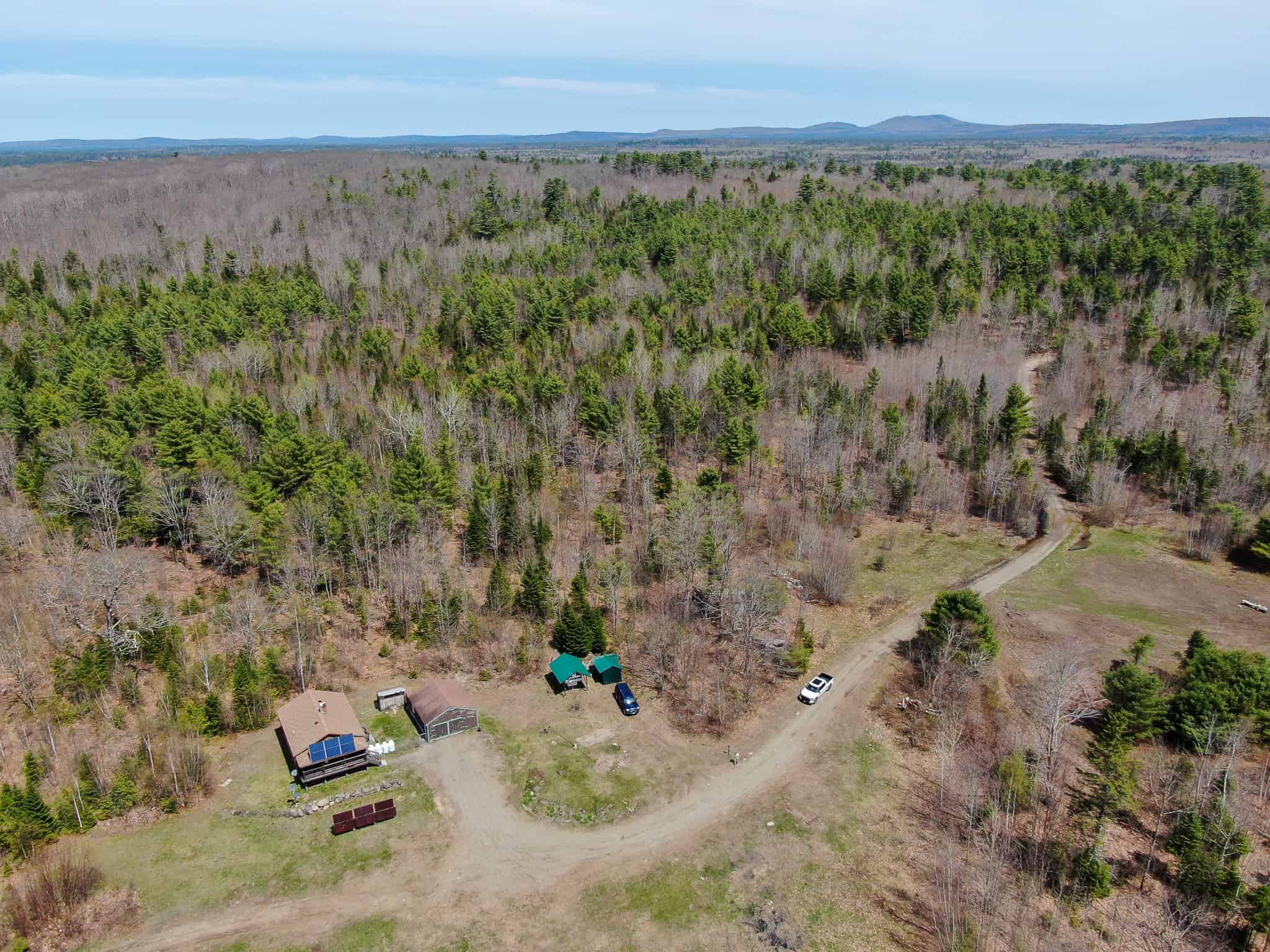Off-Grid Log Cabin Retreat on 65± Acres