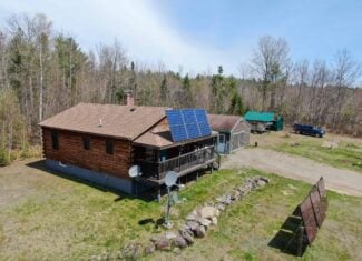 Off-Grid Log Cabin Retreat on 65± Acres