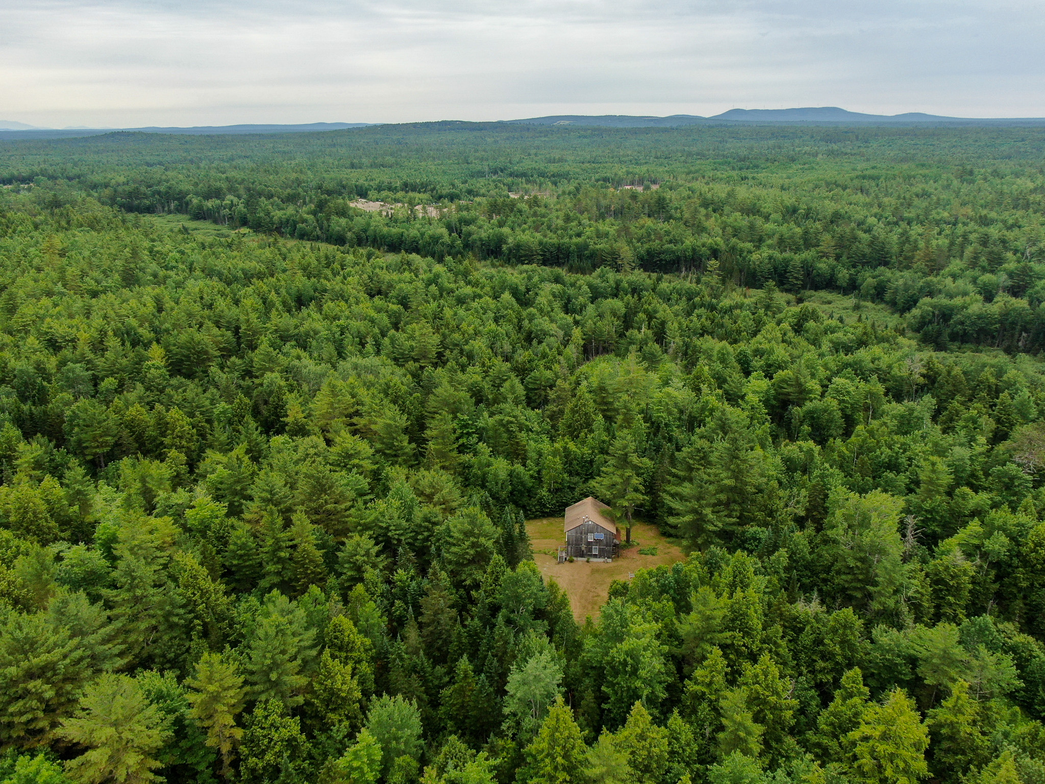 Off-Grid Maine Cabin for Sale | 26 Acres with Stream Frontage