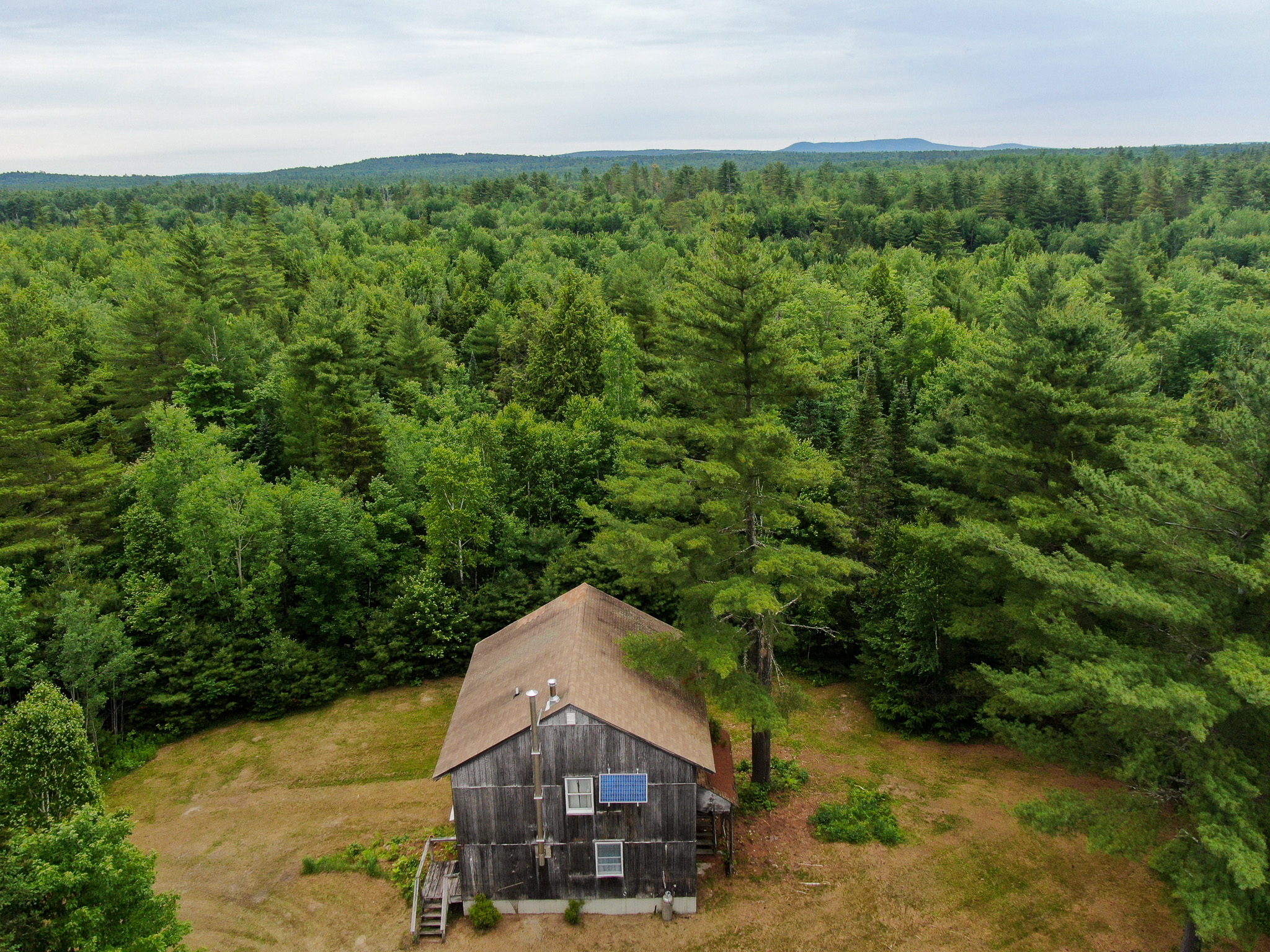 Off-Grid Maine Cabin for Sale | 26 Acres with Stream Frontage