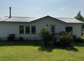 Charming Manufactured Home on 6.4 Acres with Outbuildings