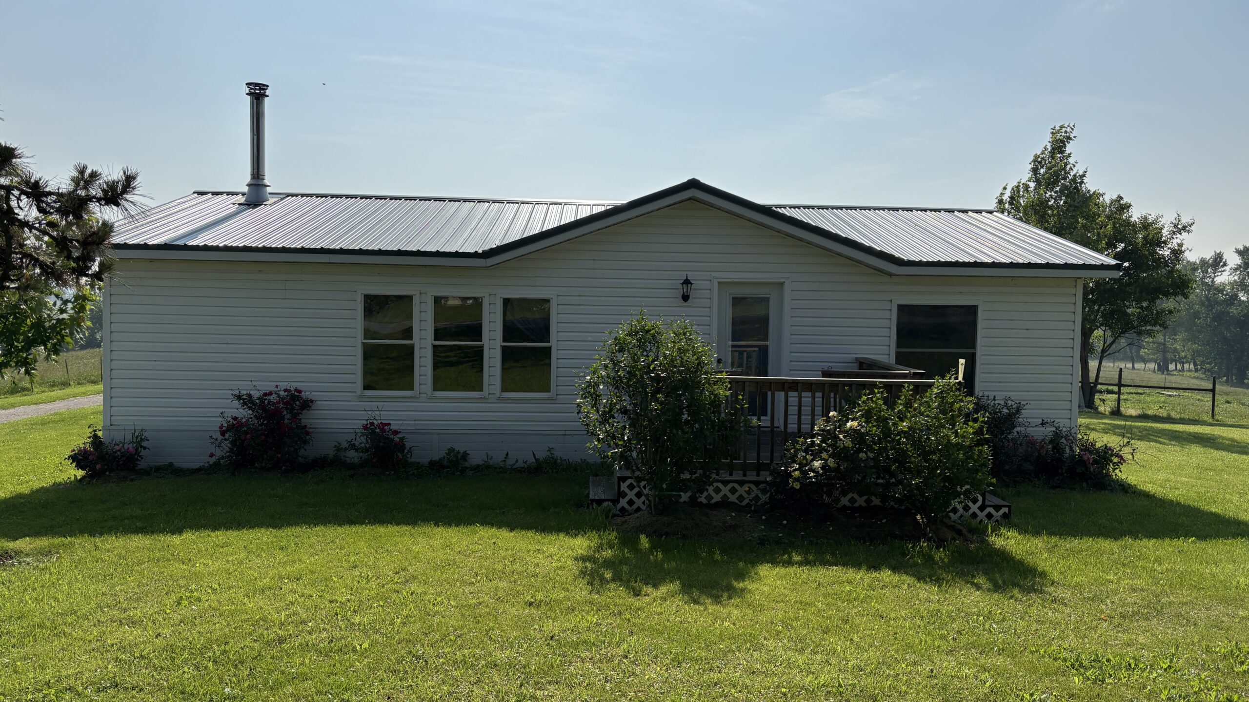 Charming Manufactured Home on 6.4 Acres with Outbuildings
