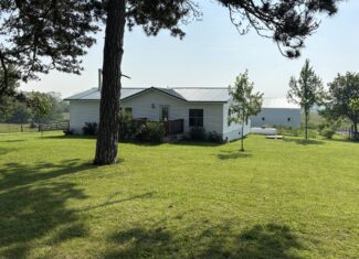 Charming Manufactured Home on 6.4 Acres with Outbuildings