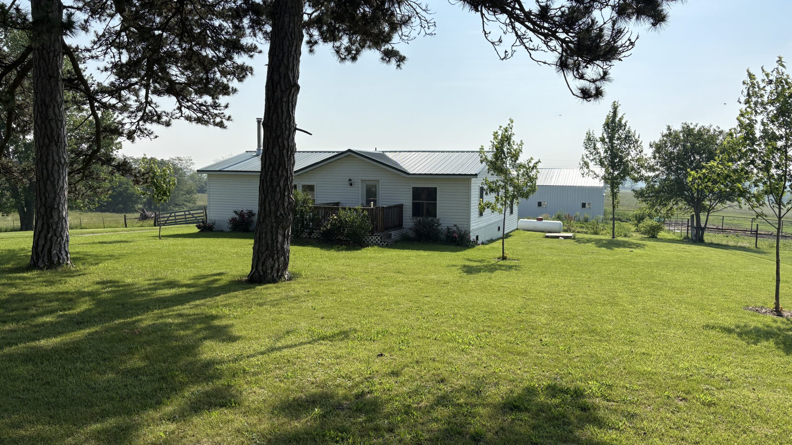 Charming Manufactured Home on 6.4 Acres with Outbuildings