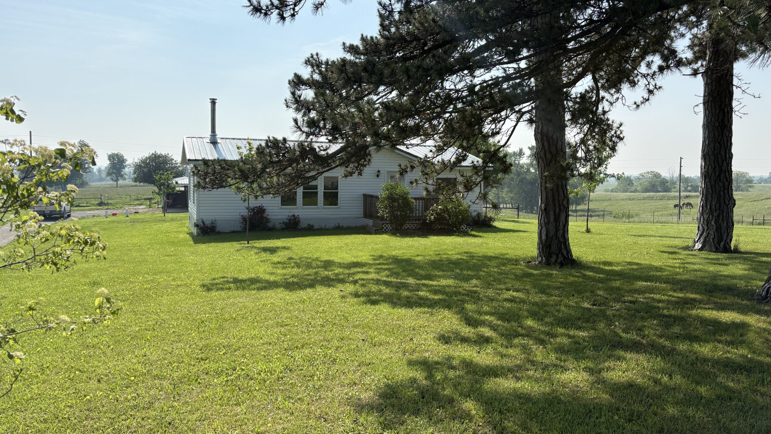Charming Manufactured Home on 6.4 Acres with Outbuildings