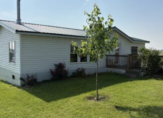 Charming Manufactured Home on 6.4 Acres with Outbuildings