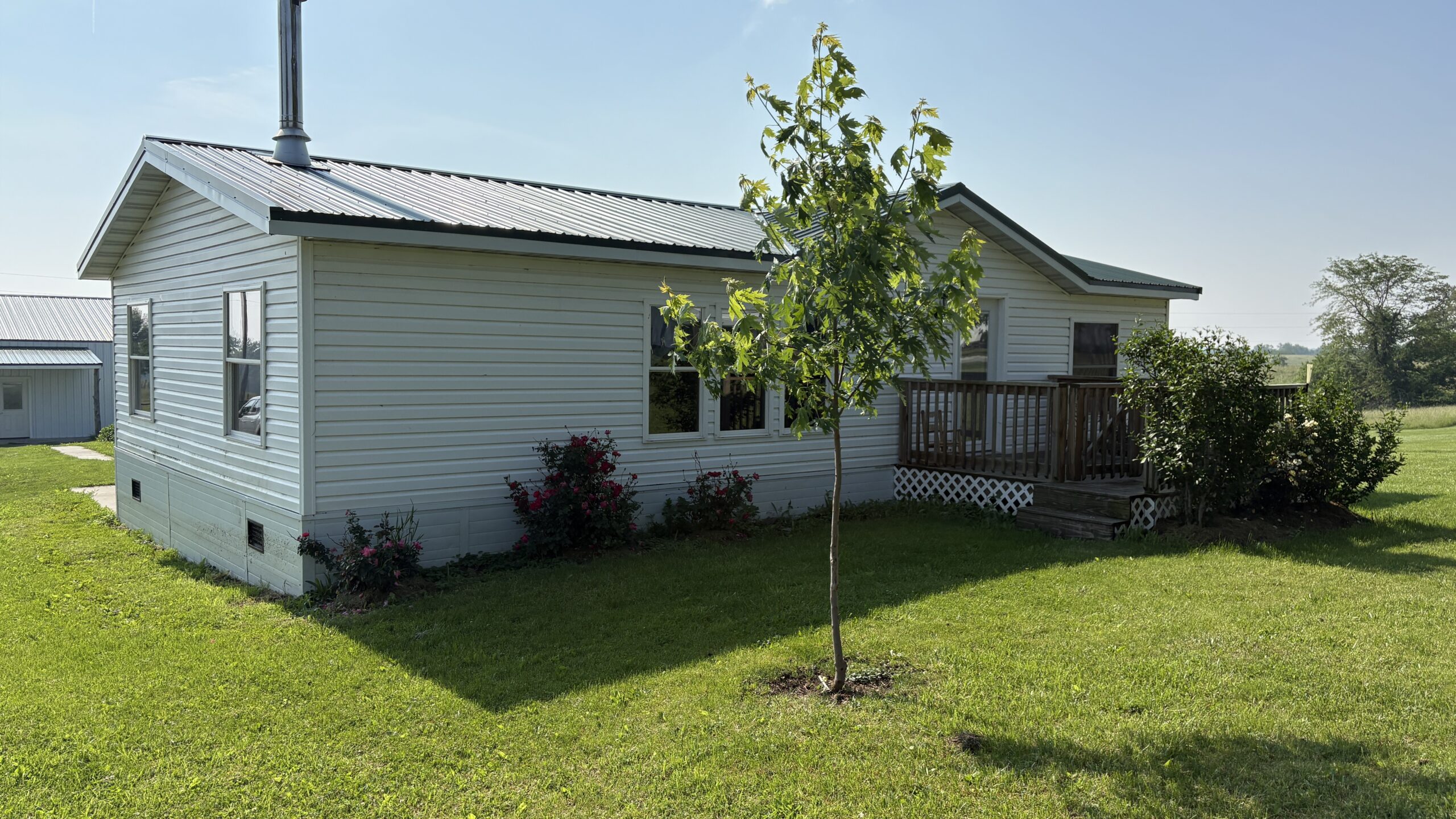Charming Manufactured Home on 6.4 Acres with Outbuildings