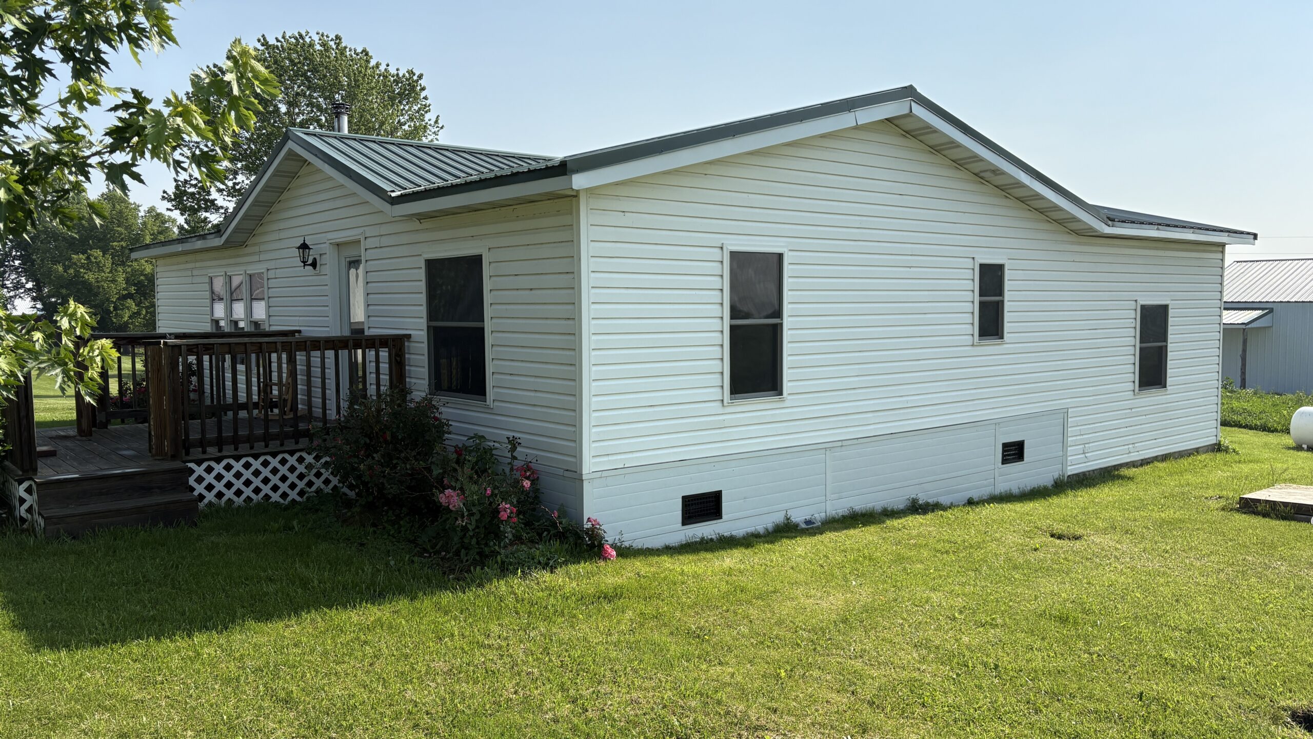 Charming Manufactured Home on 6.4 Acres with Outbuildings