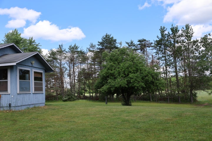 Hunter’s Paradise:  Cabin and Barn on 50 Acres Atlanta MI