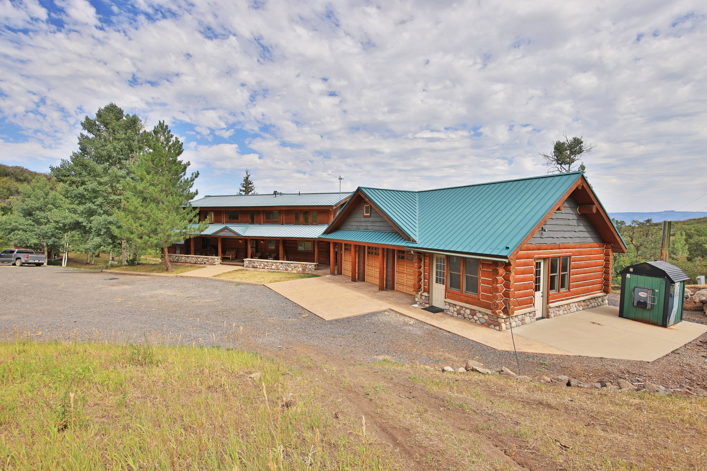 Luxury Log Home on Multiple Parcels For Sale on the Western Slope of Colorado