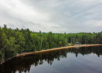 Camp with 584 Feet of Beachfront on Madagascal Pond