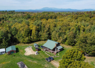 Off-Grid Log Home on 33.4 Acres
