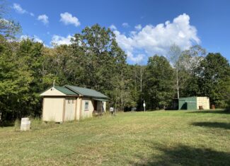 HUNTING CAMP FOR SALE IN TN. CABIN & STORAGE, 58 ACRES+/-