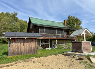 Off-Grid Log Home on 33.4 Acres