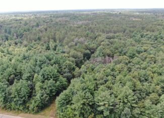 Escape to 80 acres of heavily timbered ground in Adams County